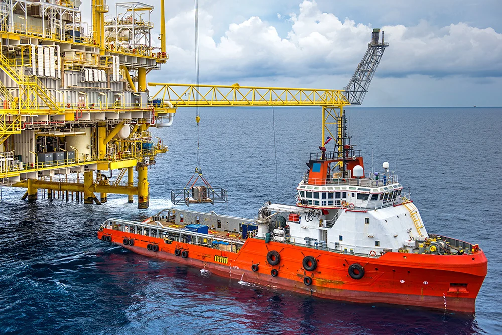 Ship-to-shore cranes handling containers at a UK port