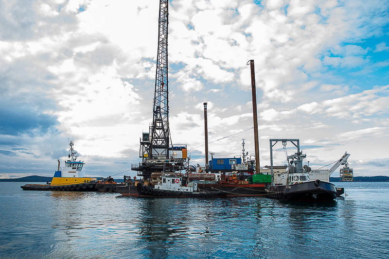 Marine contractor working vessel alongside a UK quay during a mooring installation