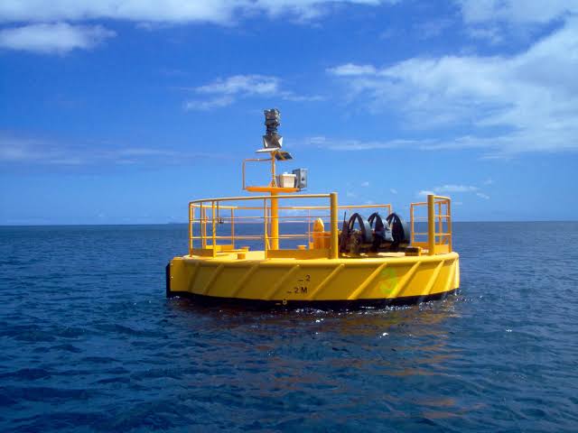 Mooring buoy holding floating marine infrastructure on station
