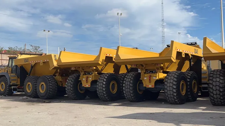 Tracked plant hauling material on a UK earthworks programme