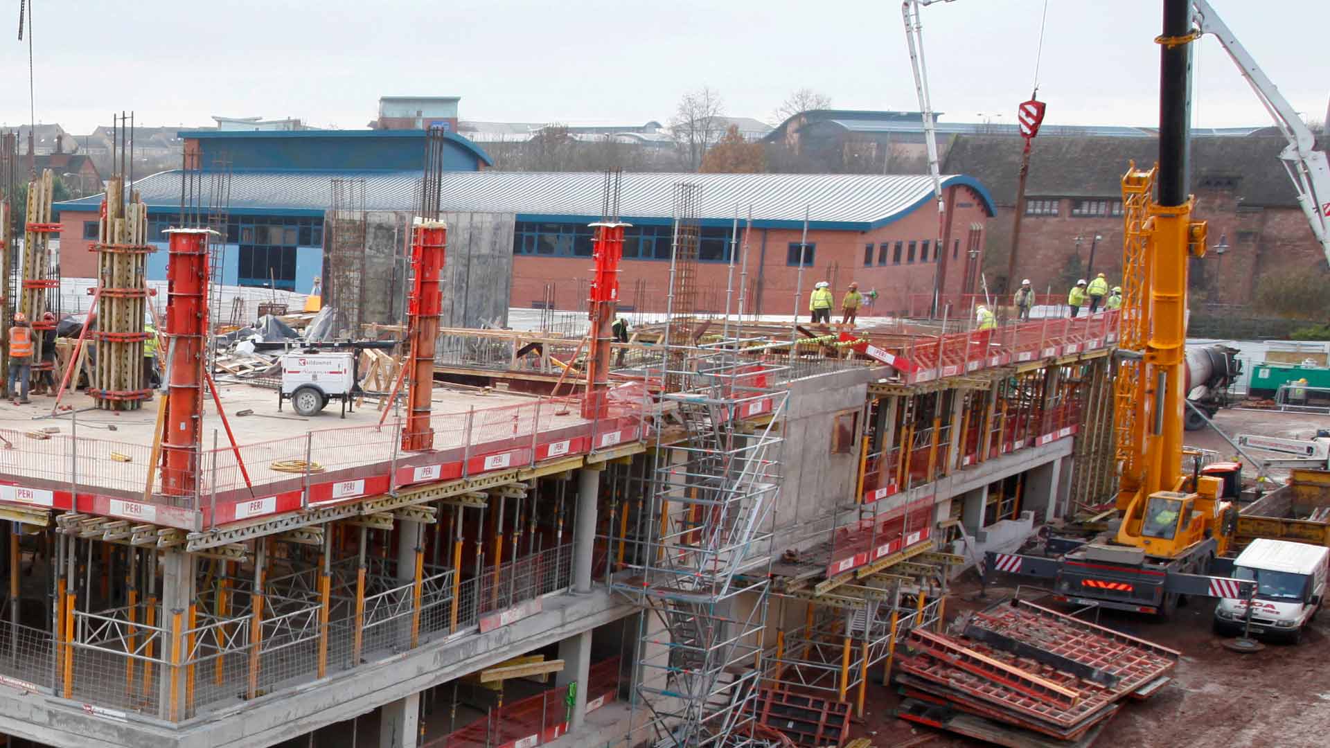 Active civil engineering construction site with formwork and reinforcement in progress
